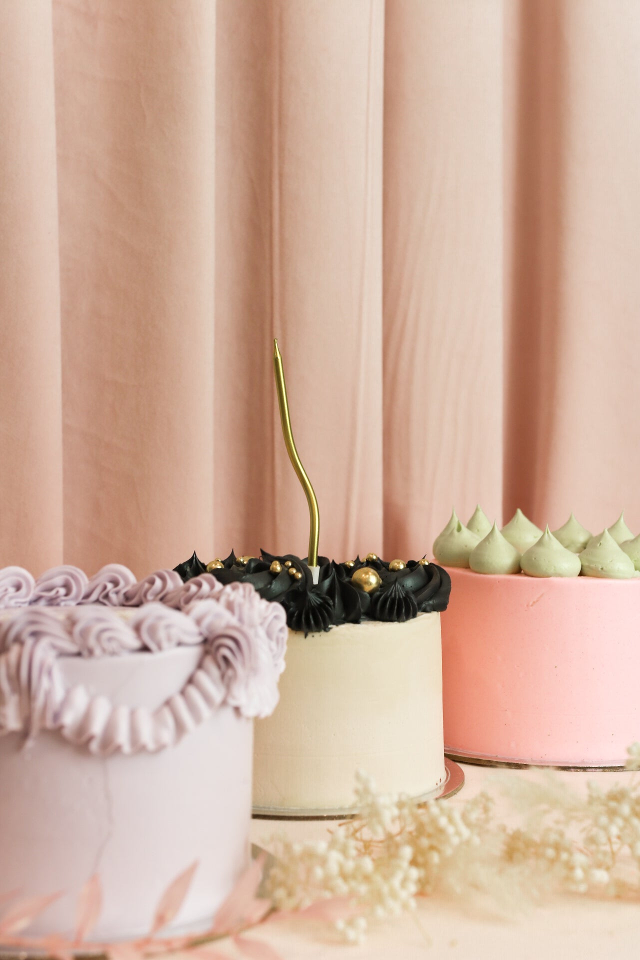 Three bento cakes with different decor